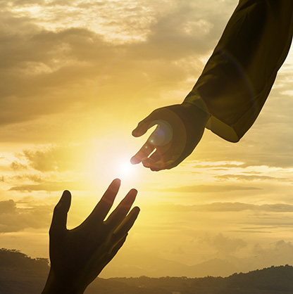 Silhouette of Jesus giving helping hand